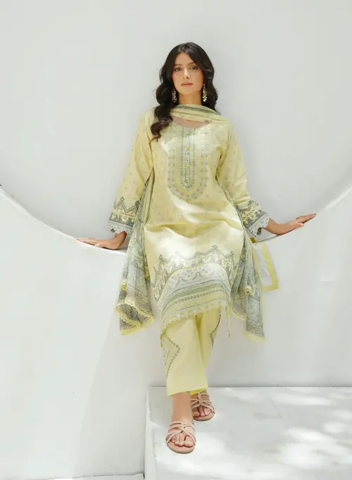 An Indian woman wearing a kurti posing in an aesthetic location.